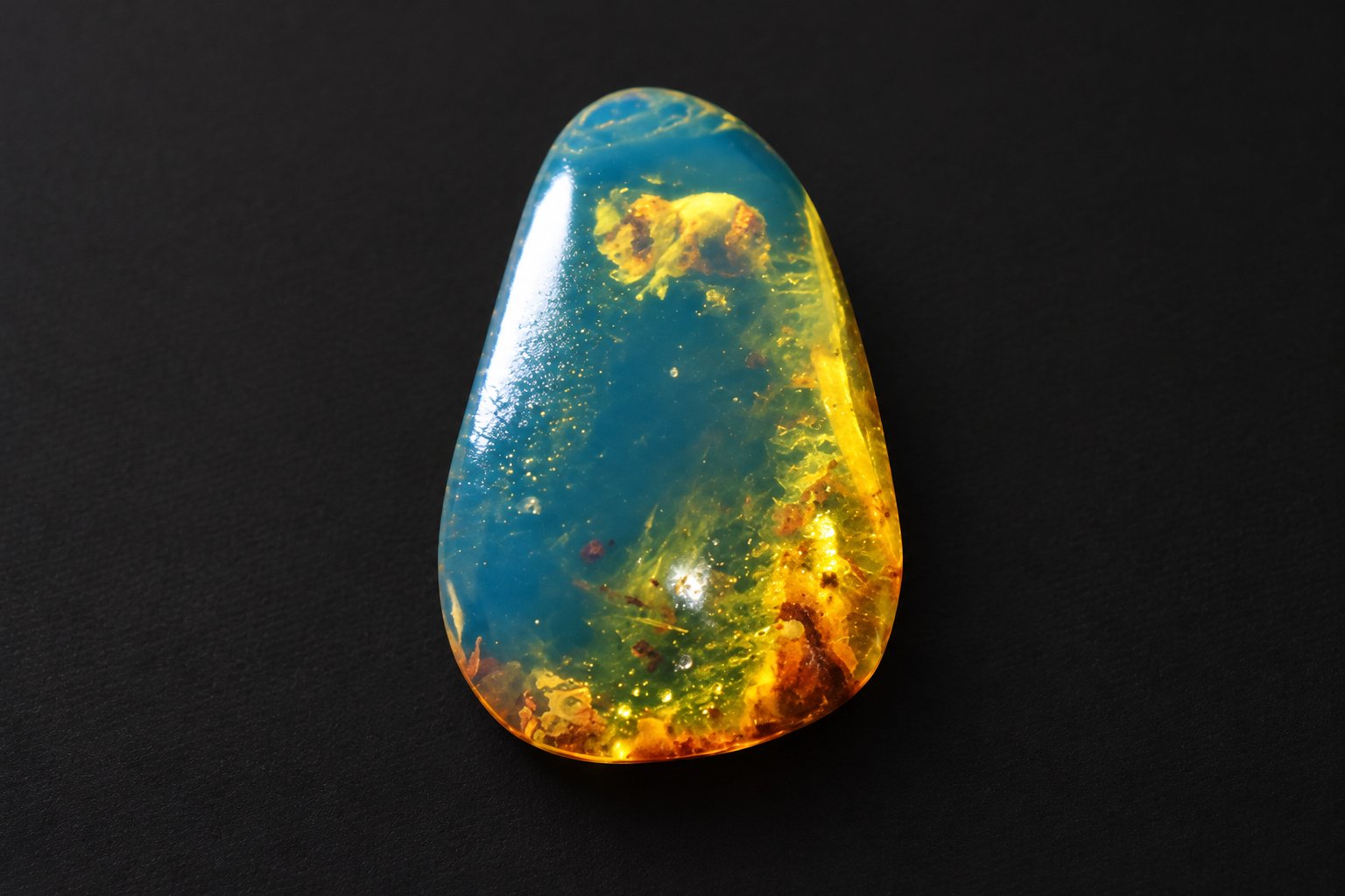 Earth crafted deep blue Dominican amber cabochon – photo 7